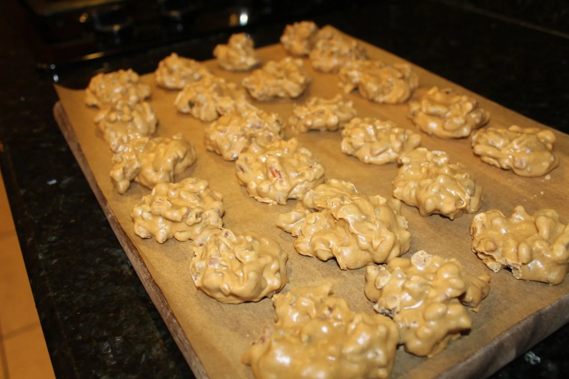 Freshly baked cookies cooling on a baking sheet